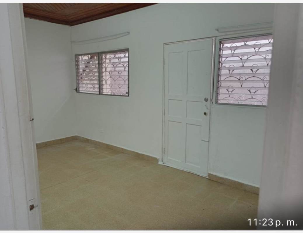 Minimalist empty room with tiled floors and secured windows rental in San Antonio Panama