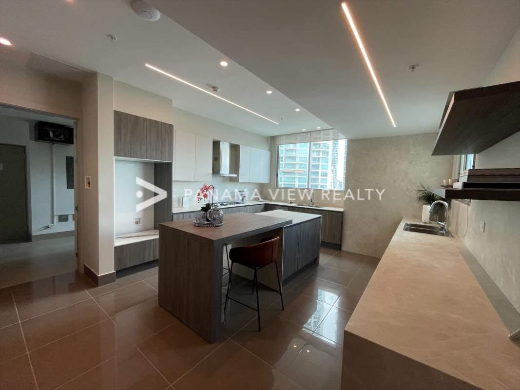 Modern kitchen design with marble island built-in appliances in Pacific Point Punta Pacifica apartment