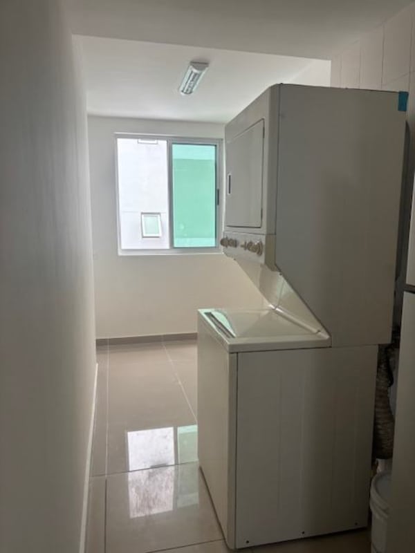 Contemporary bathroom with ceramic sink, wood cabinetry, tiles and mirror in Panama condo