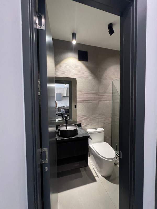 Open kitchen with granite countertops and appliances in ocean view apartment Coco del Mar Panama