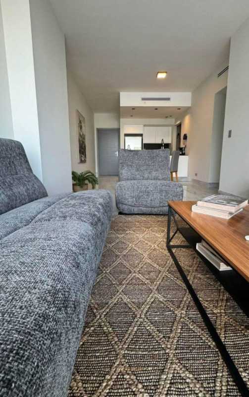 Modern living room gray sofa city skyline views Nuovo by Armani Casa Panama