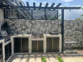 Contemporary kitchen with granite countertops, stove, refrigerator in Playa Dorada Veracruz Panama