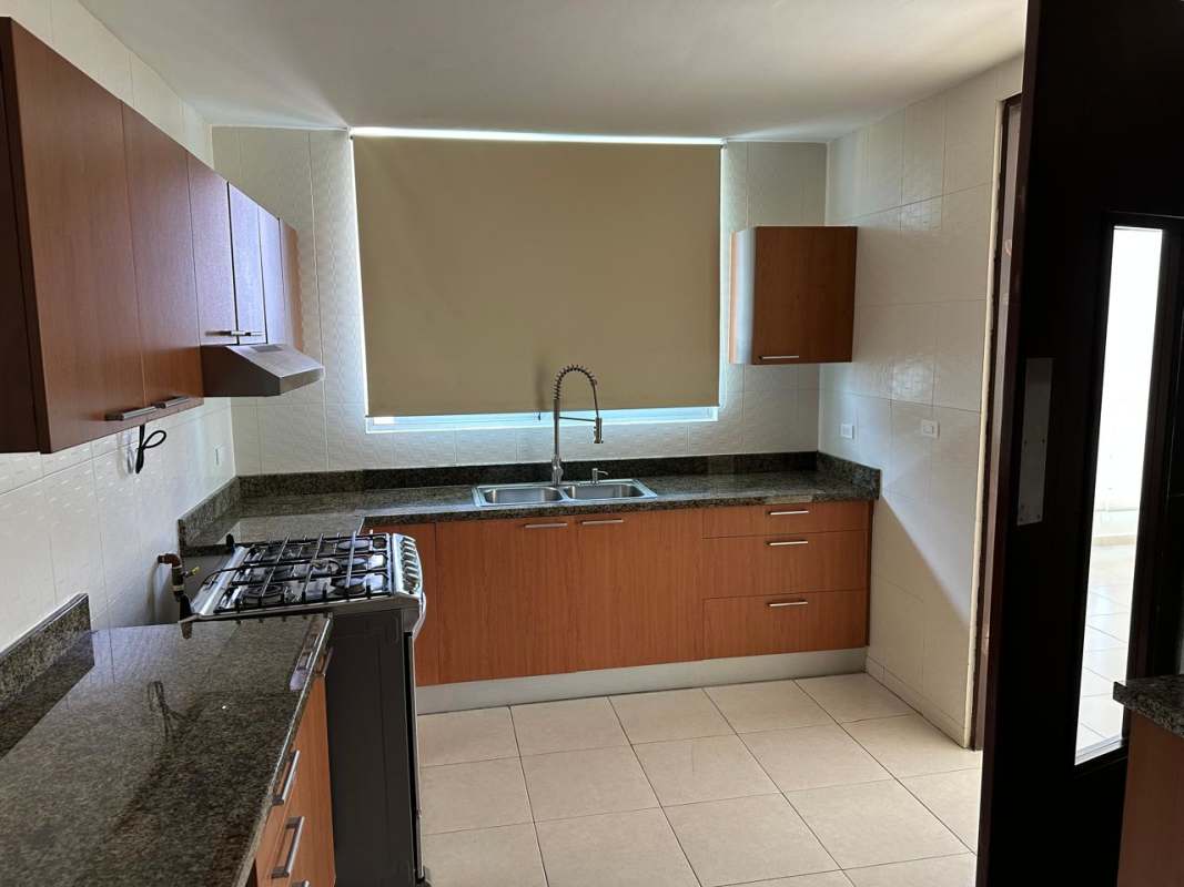 Elegant bathroom granite countertop glass-enclosed shower PH Soho Tower Panama