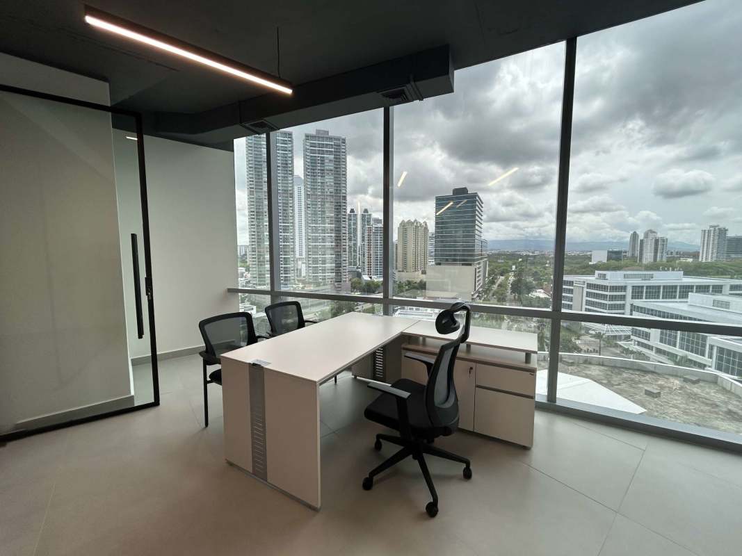 Spacious open office area with large windows overlooking Costa del Este skyline in Financial Park Tower Panama