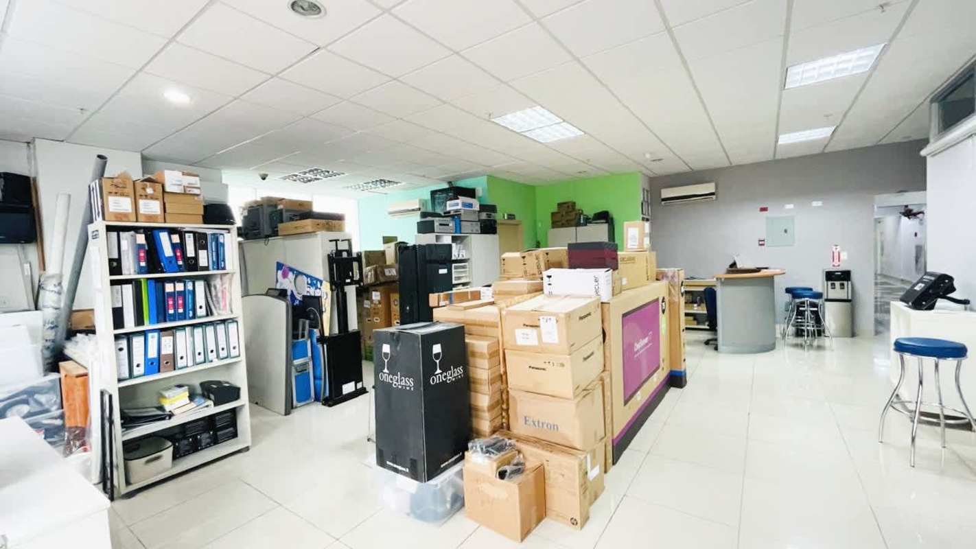 Interior storage room and workspace with partitions, boxes, and tiled floor at Brazil 405 Tower Panama