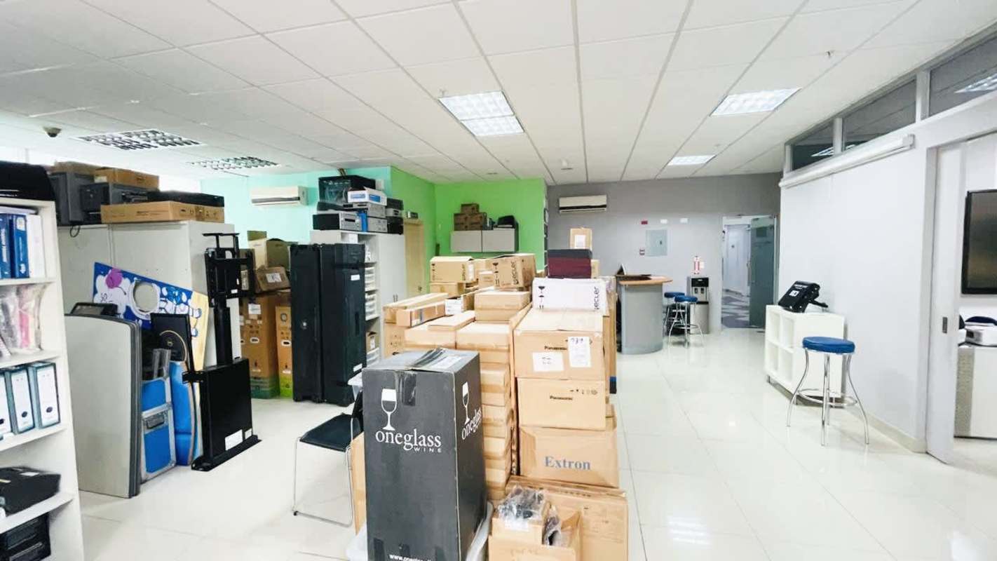 Storage room with electronics, equipment, and shelving inside Brazil 405 commercial tower Panama