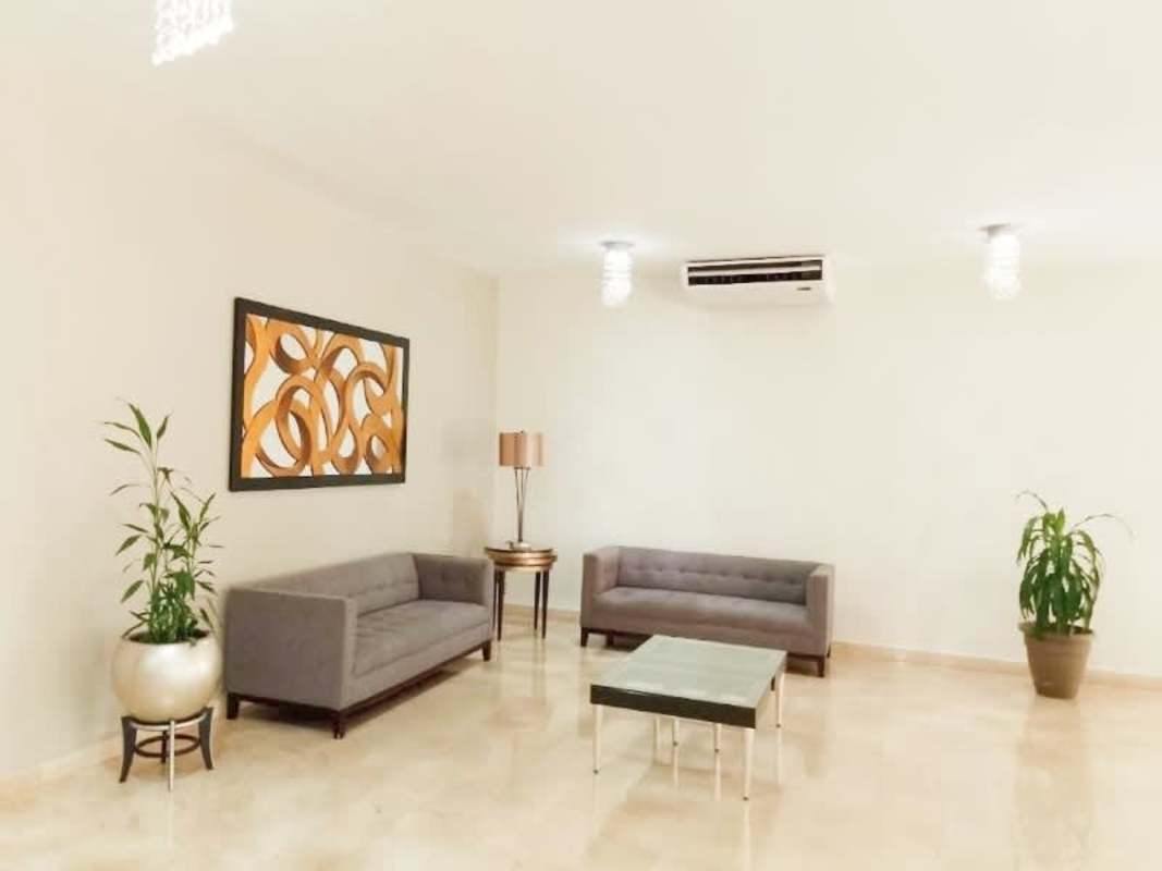 Modern living room with city view windows PH Arrecife Punta Paitilla Panama