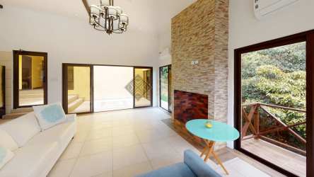 Kitchen with modern cabinetry stainless appliances and large windows Altos del María