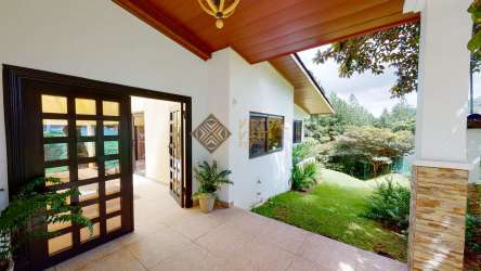 Outdoor pool area with lush forest views in Altos del María modern home Panama