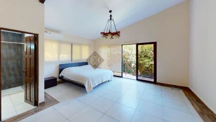 Large modern bedroom with vaulted ceiling and balcony access Altos del María Panama