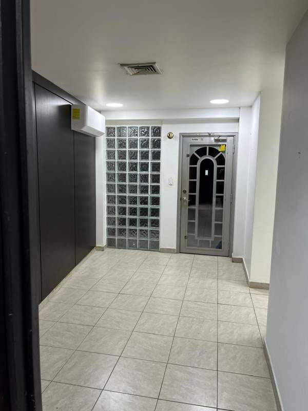 Entrance hallway with tile floors, glass block partition and air conditioning PH Office Plaza San Francisco Panama