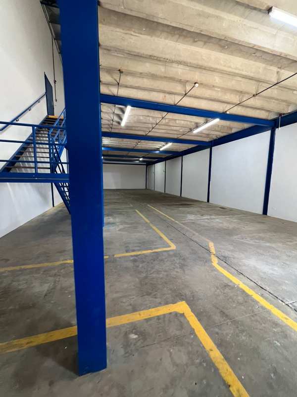 Mezzanine level and metal stairs inside commercial warehouse Los Pueblos Juan Díaz Panama