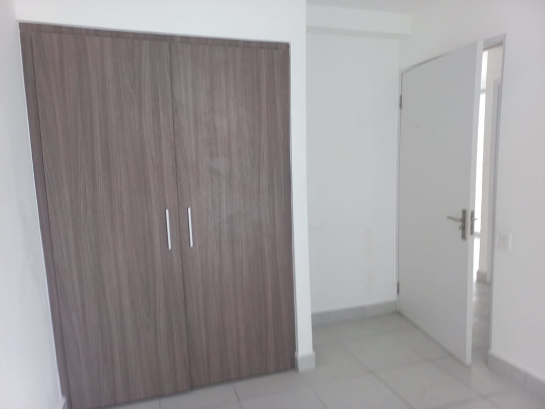 Exterior high-rise condo building PH Ilo with parking and balconies in Panama City