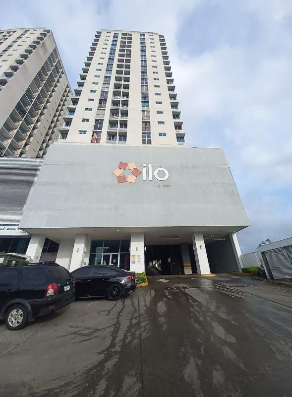 Apartment kitchen area with refrigerator and entrance door in PH Ilo Río Abajo Panama City
