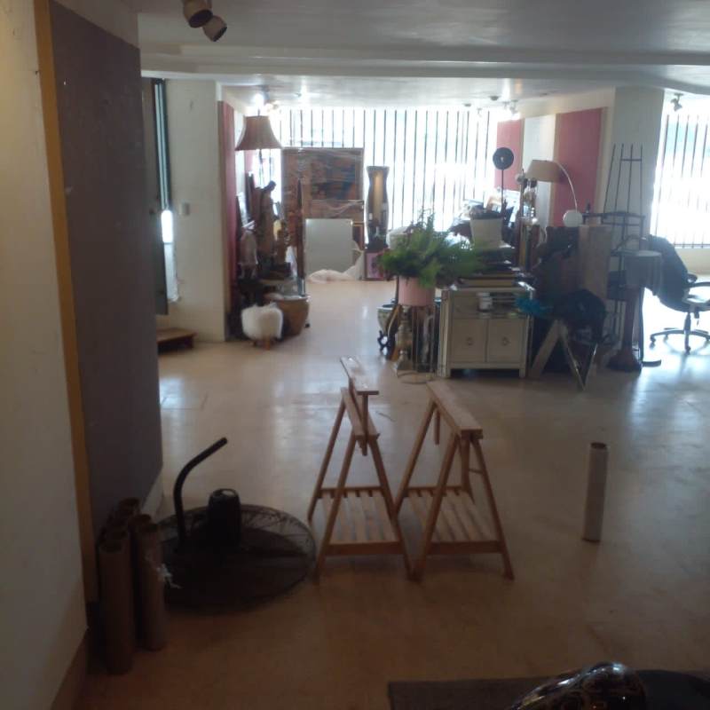 Open airy upstairs studio workspace with large windows vertical blinds for lease Obarrio Panama