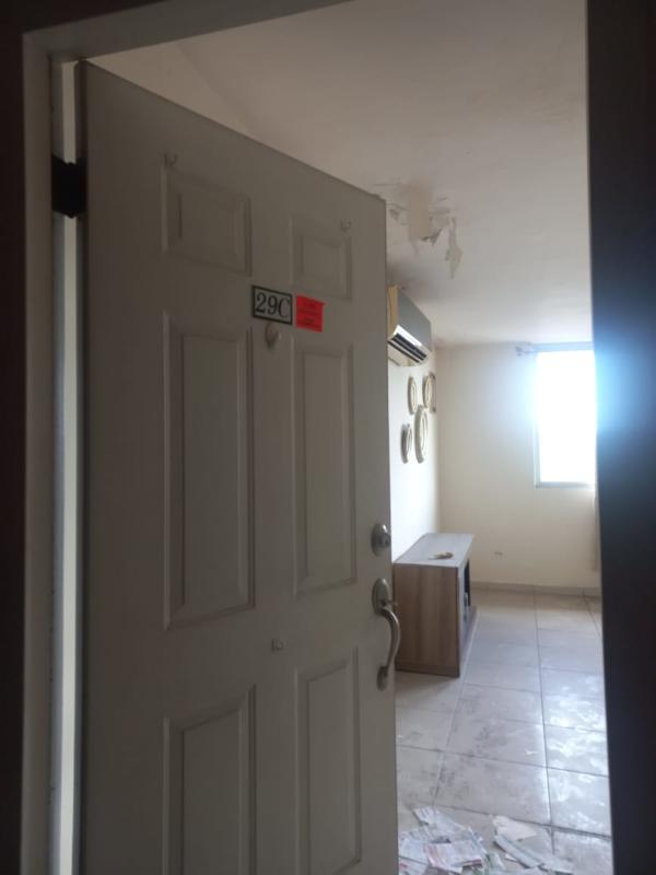 Dining area with large windows, beige curtains, minimalist style in Mallorca Park Village Los Andes Panama