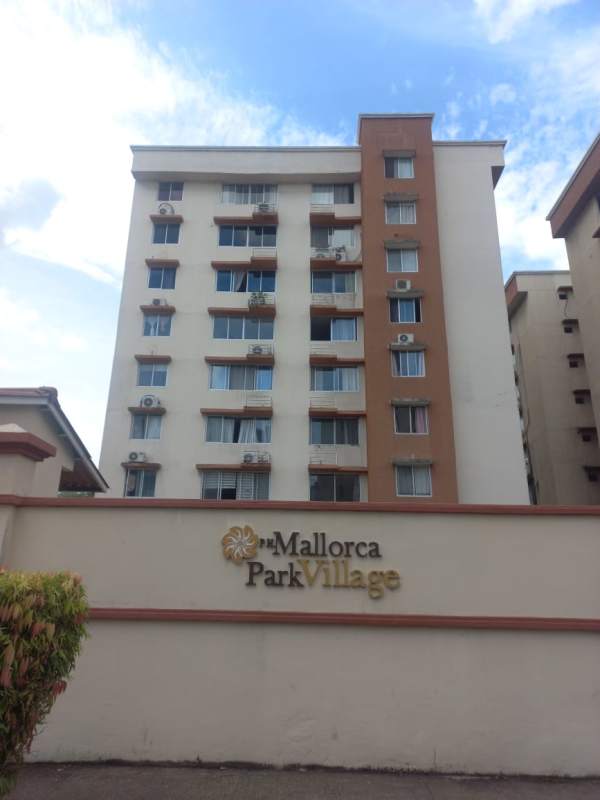 Gated multi-story apartment complex with balconies at Mallorca Park Village Los Andes Panama