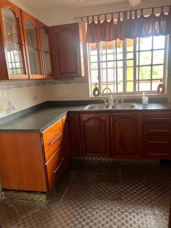 Empty living room with chevron accent wall, tile flooring, ceiling fan and AC Residencial Bariloche Panama