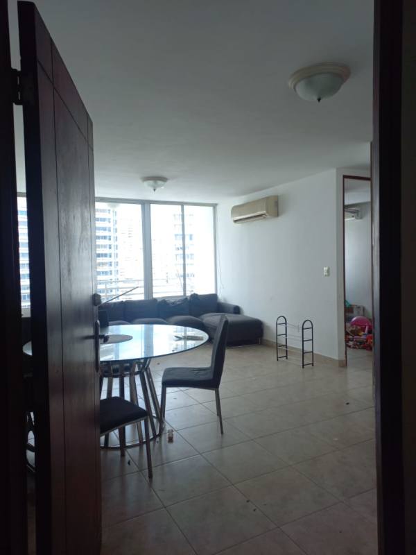 Spacious living and dining room with city view balcony, large windows PH Marquis Tower Panama