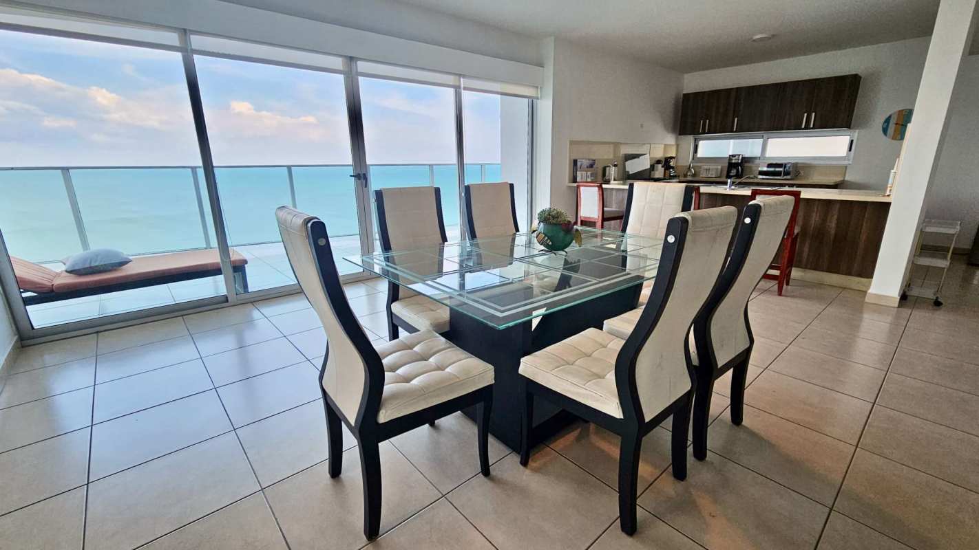Kitchen with granite counters, breakfast bar, wood cabinets Punta Pacifica Oasis on the Bay condo