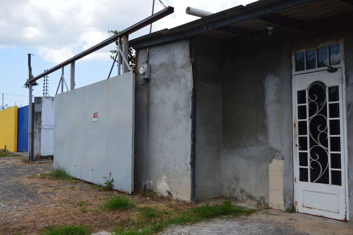 Gated entrance with security features at commercial warehouse Las Acacias Don Bosco Panama