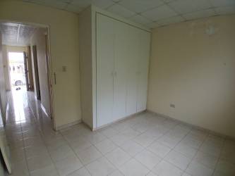Simple empty bedroom with tile floor Lago Emperador Nuevo Emperador Panama