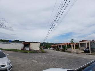 Residential street with single-story houses in Lago Emperador Panama