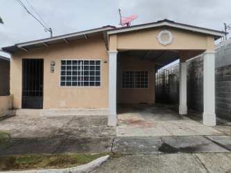 Single-story beige house with covered driveway carport and fenced yard in El Palmar Chapala Arraijan Panama