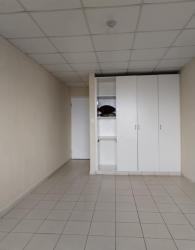 Bedroom with tile floor and built-in white wardrobe at El Palmar Chapala Nuevo Emperador Panama