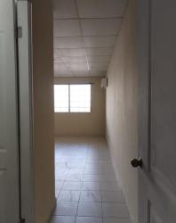 Bedroom with air conditioning, tiled floors, beige walls at El Palmar Chapala Arraijan Panama