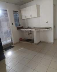 Simple kitchen interior with cabinets and sink at El Palmar Chapala house for rent Panama