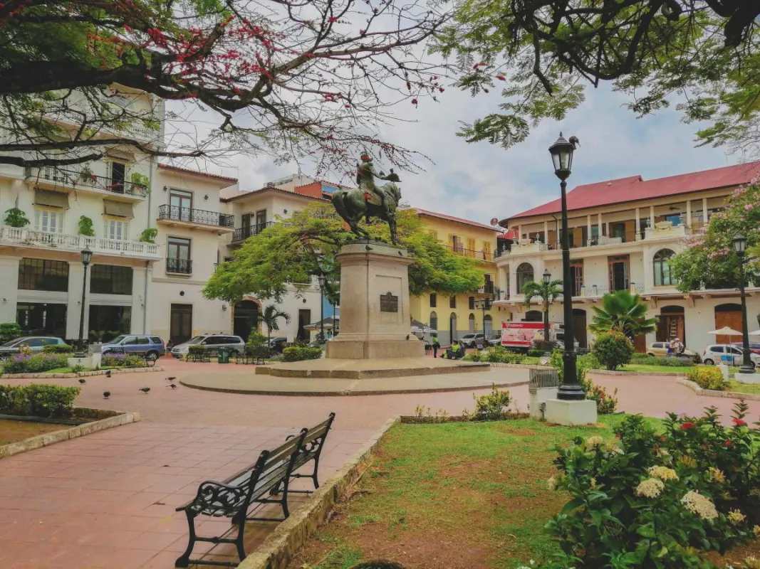 Historic Plaza Herrera with statue, colonial buildings and commercial spaces in Casco Viejo Panama