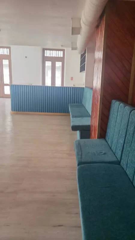 Interior lounge area with wood paneling and built-in bench seating Casco Viejo Panama