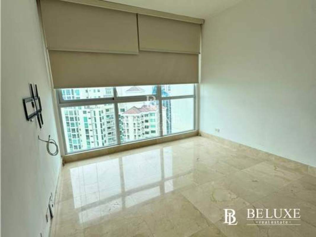 Bright living room floor-to-ceiling windows city skyline view PH Dupont Punta Pacifica Panama