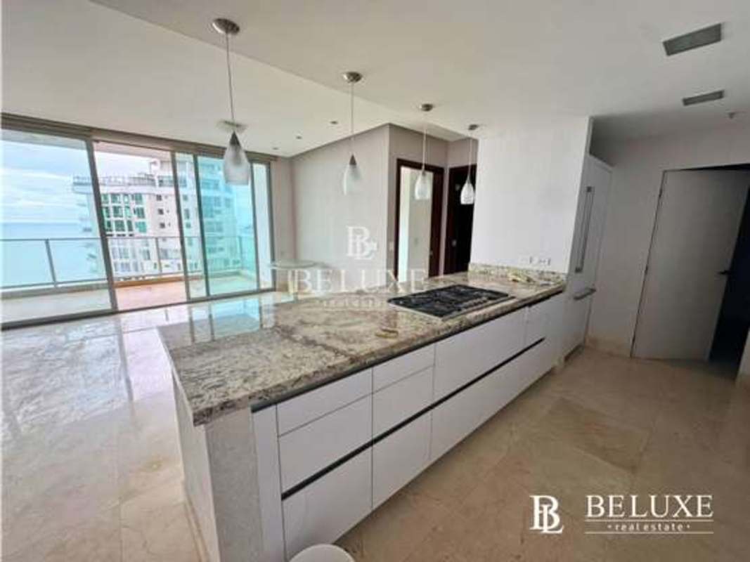 Modern kitchen with granite counters integrated with living-dining room PH Dupont Punta Pacifica Panama