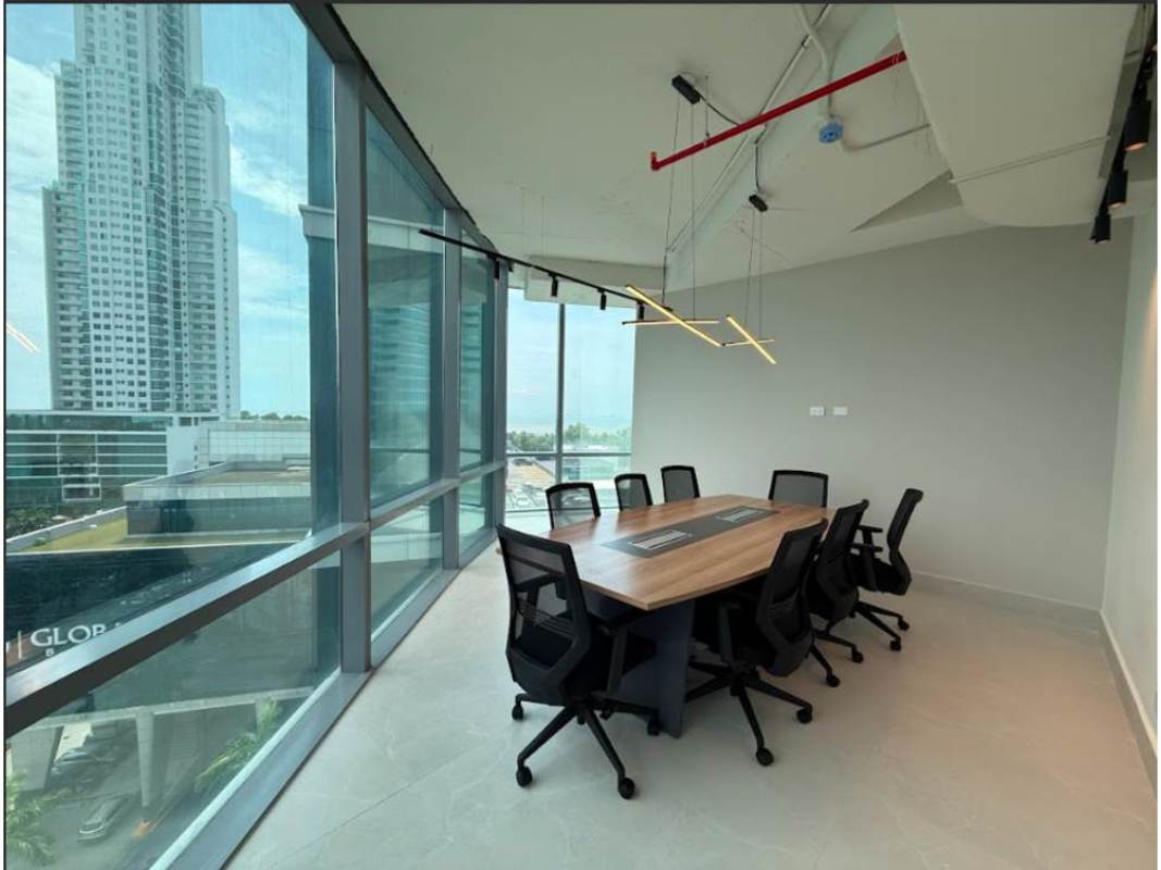 Spacious conference room with large windows overlooking city skyline in Financial Park Tower Costa del Este