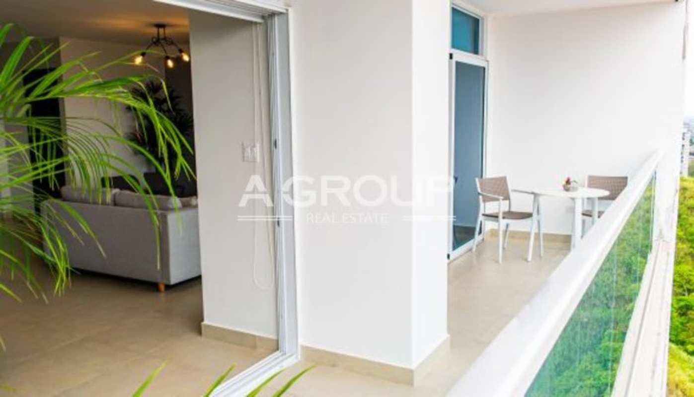 Private balcony with glass railing overlooking city and gardens, PH Country Heights Panama