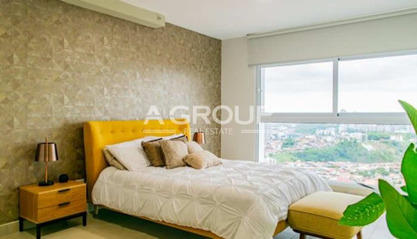 Modern bedroom with large windows, city views, and stylish decor at PH Country Heights Panama