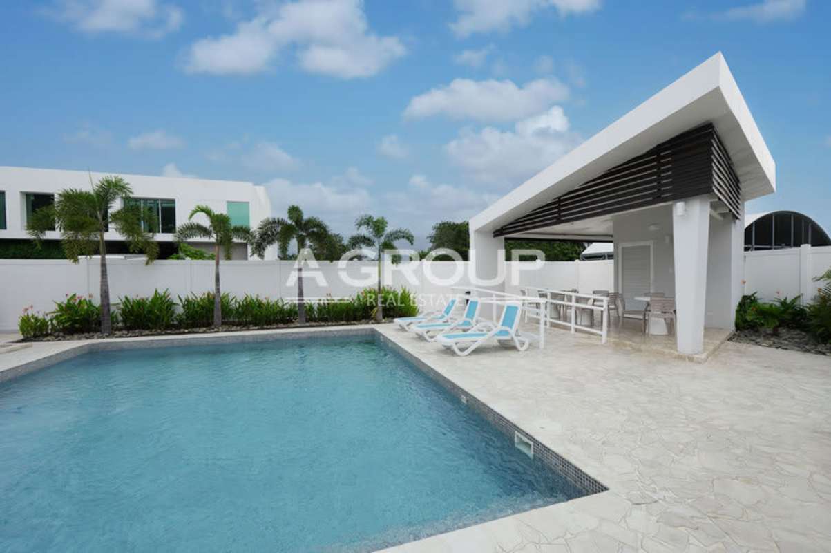 Modern kitchen with granite countertops and appliances in Panama Viejo Residences Chanis Panama