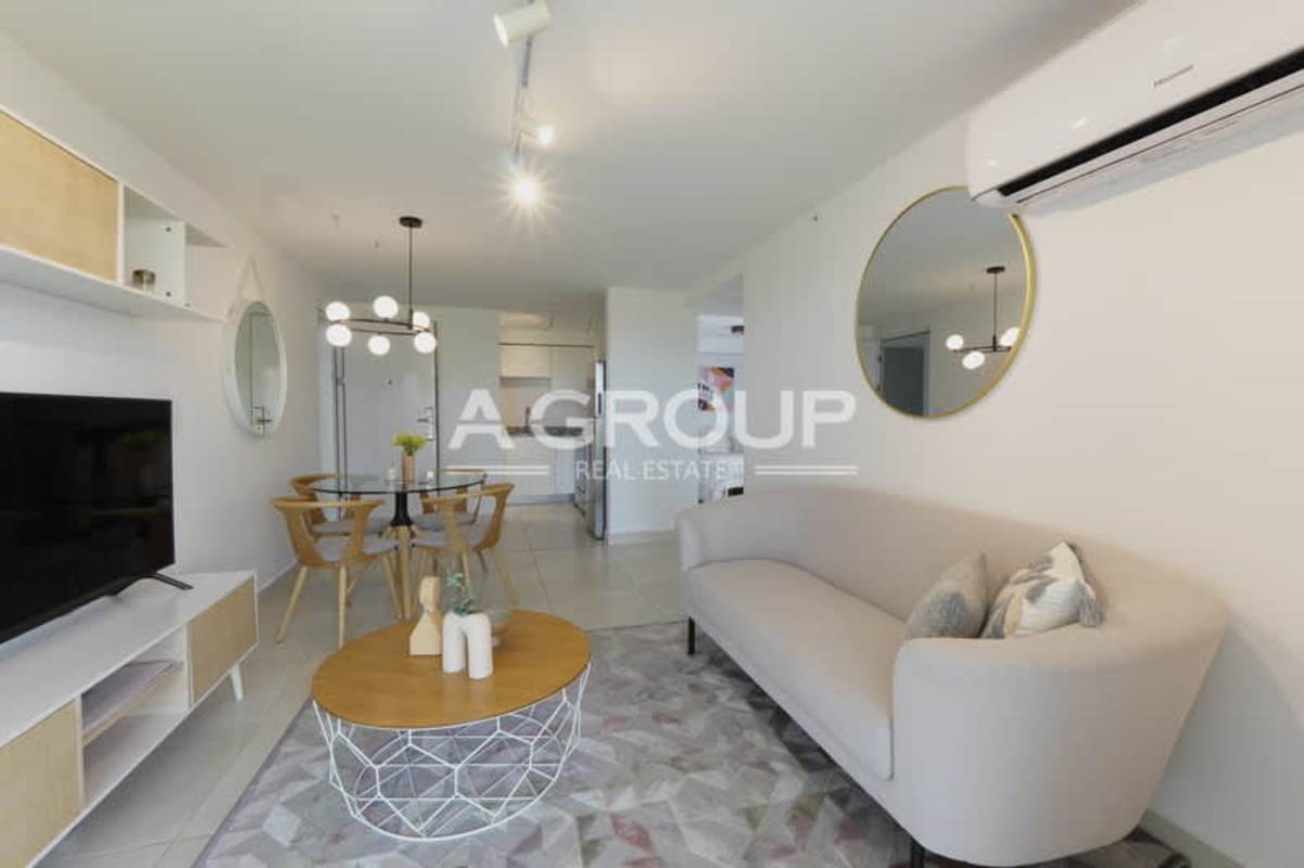 Contemporary kitchen with granite countertops, cabinets, stainless steel appliances at Panama Viejo Residences