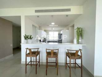 Contemporary kitchen with granite surfaces, appliances, and coastal light in Casamar San Carlos Panama