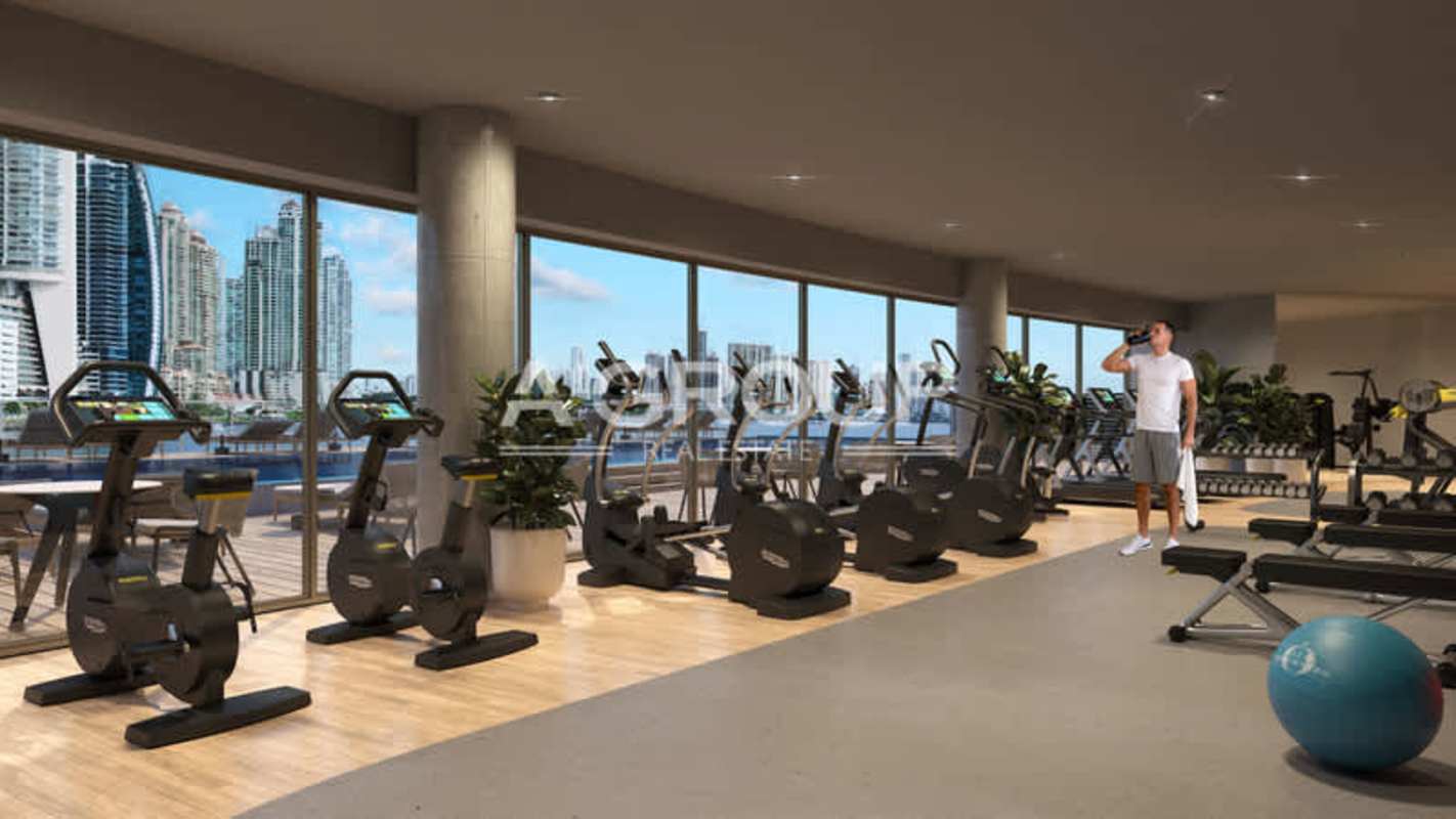 Modern fitness center featuring skyline ocean views at Beach Club Residences Panama