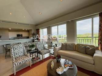 Contemporary kitchen with stainless steel appliances and granite countertops at Laguna Buenaventura condo