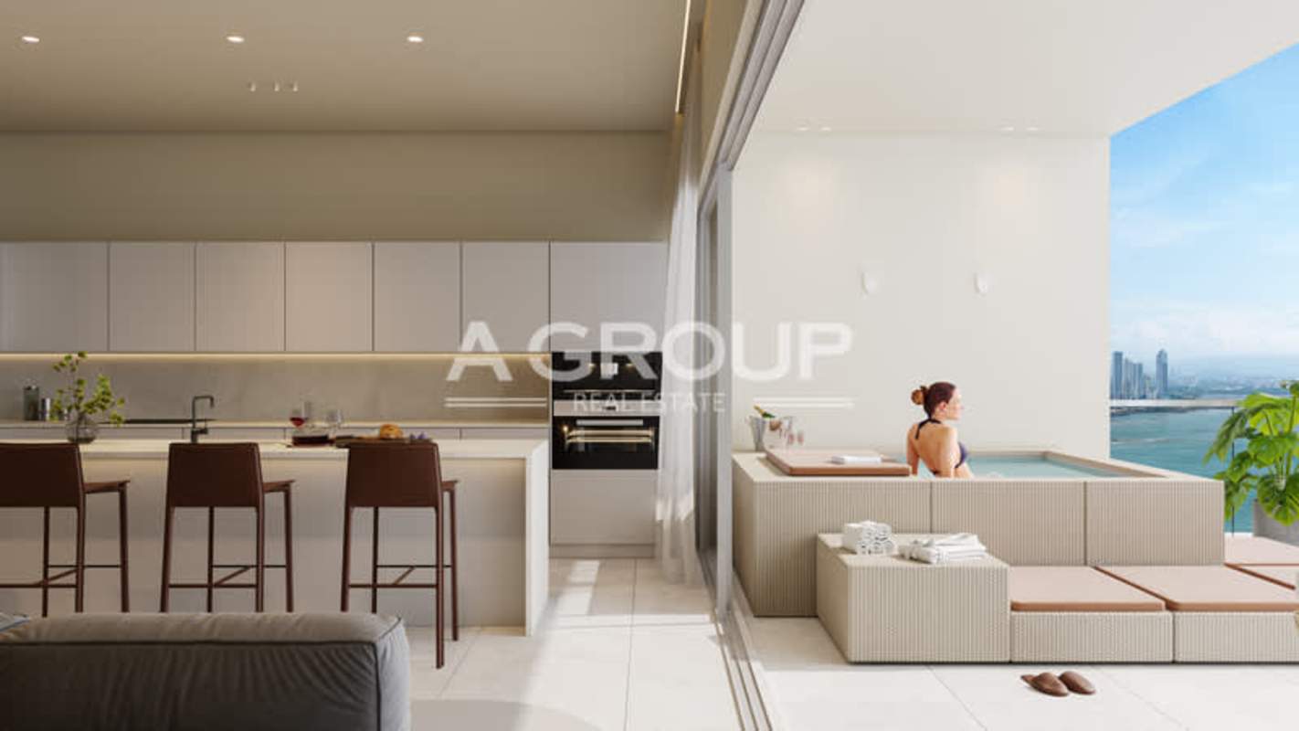 Modern minimalist kitchen connected to balcony with ocean view and outdoor soaking tub