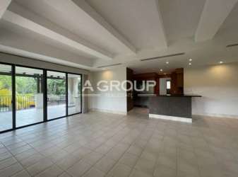 Contemporary kitchen with wood cabinetry granite counters Buenaventura beach apartment Panama