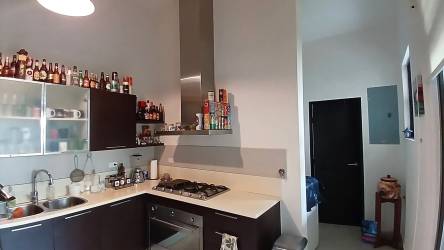 Spacious master bedroom with private balcony at PH Nativa Panama Pacifico