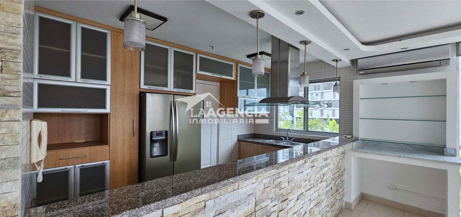Modern bathroom with granite vanity, glass shower door, tiled walls at PH Tao San Francisco