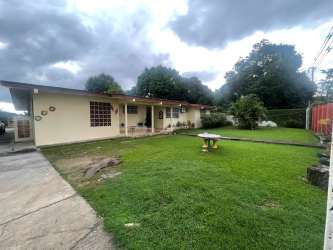Modern bathroom with glass shower enclosure granite tile Penonome Cocle Panama