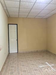 Empty tiled room with neutral colors in mountain house Panama