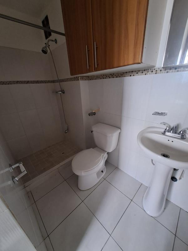 Modern bathroom featuring walk-in shower, pedestal sink in PH Llano Bonito Panama